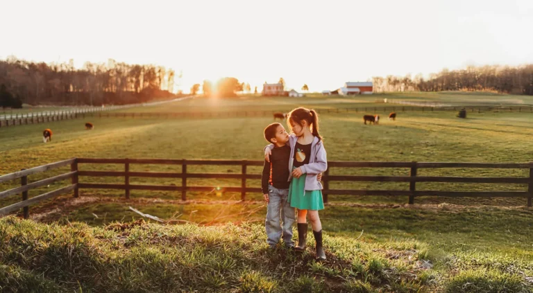 children with autism embracing in rural area