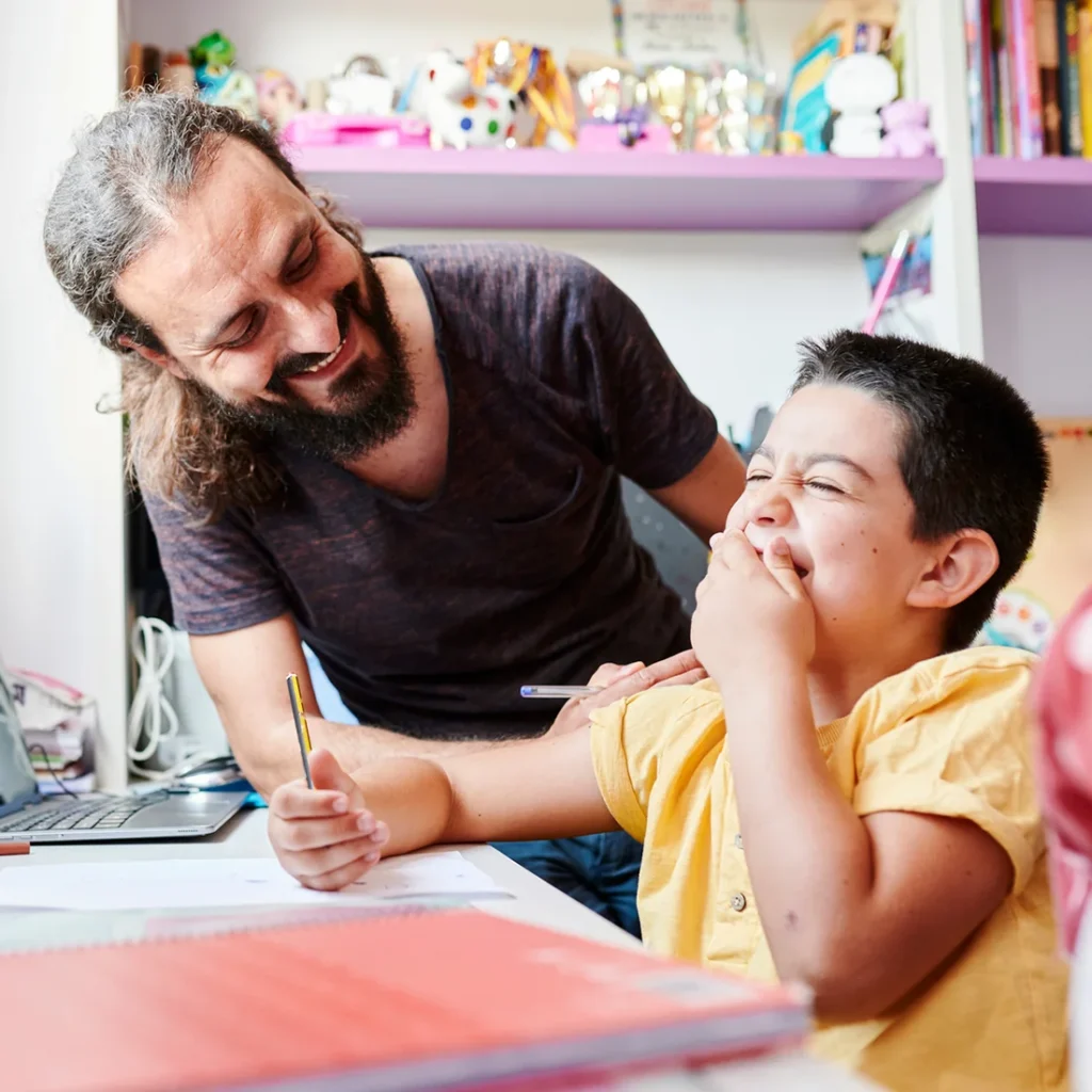 Father and son with autism interacting