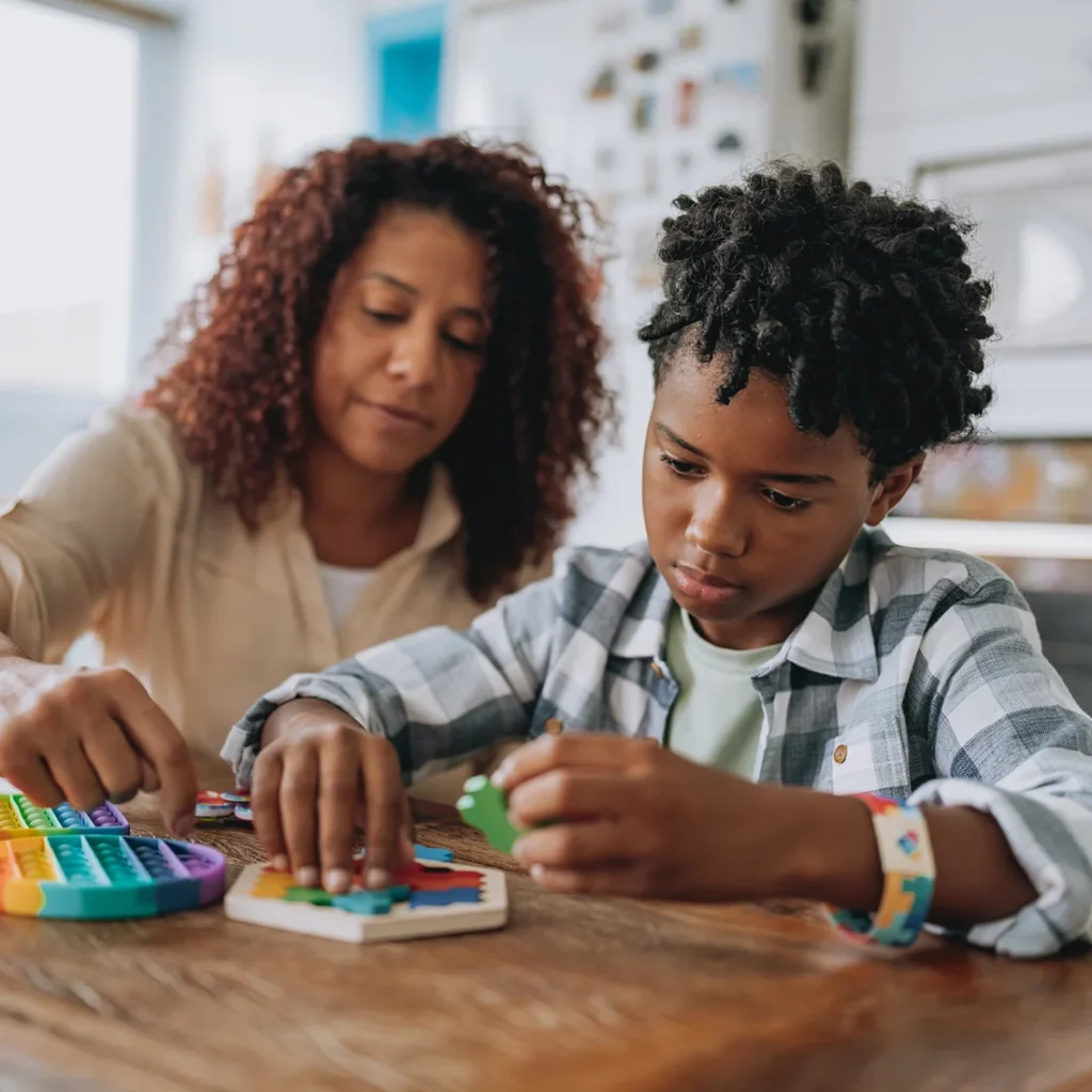 ABA professional assisting child with ABA therapy